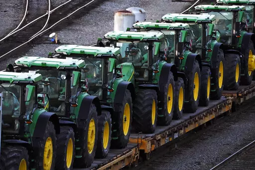 A consist of John Deere tractors sit in Norfolk Southern's Conway Yard in Conway, Pa., Monday, Dec. 5, 2022. On Thursday, the Labor Department releases the producer price index for January, an indicator of inflation at the wholesale level that's closely monitored by the Federal Reserve. (AP Photo/Gene J. Puskar, File)