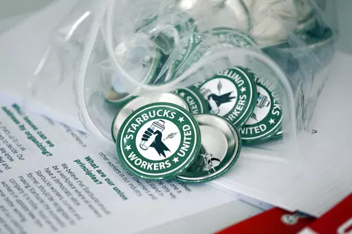 Pro-union pins sit on display, Dec. 9, 2021. Employees at a Starbucks store in New Orleans are the first of the coffee giant's locations in Louisiana to unionize, voting 11-1 in favor of joining a union on Friday and Saturday, June 3-4, 2022. (AP Photo/Joshua Bessex, File)