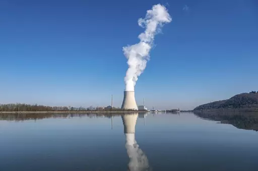 Water vapor rises from the nuclear power plant Isar II in Essenbach, Germany, March 3, 2022. Germany is shutting down this nuclear power plant and two others on Saturday, April, 2023, as part of an energy transition agreed by successive governments. (Armin Weigel/dpa via AP, File)