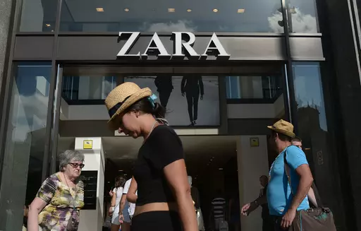 People walk past a Zara store in Barcelona, Spain, Aug. 27, 2014. The Spanish fashion brand Zara has pulled advertising images that to some appeared to reference Israel’s war against Hamas in Gaza. (AP Photo/Manu Fernandez, File)