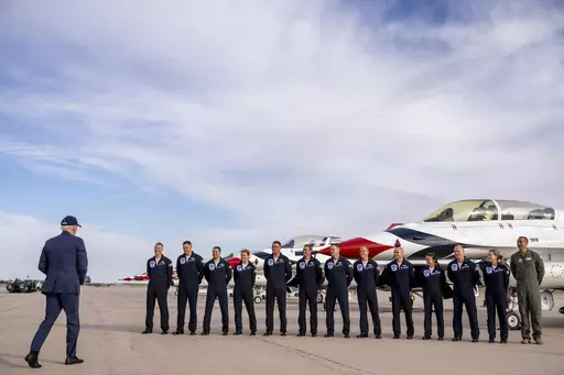 President Joe Biden greats a group of Thunderbird pilots after arriving at Peterson Space Force Base in Colorado Springs, Colo., Wednesday, May 31, 2023. Biden has decided to keep U.S. Space Command headquarters in Colorado, overturning a last-ditch decision by the Trump administration to move it to Alabama and ending months of politically fueled debate, according to senior U.S. officials. (AP Photo/Andrew Harnik, File)