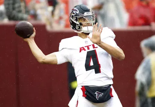 Atlanta Falcons quarterback Desmond Ridder (4) throws before an NFL football game against the Washington Commanders on Nov. 27, 2022, in Landover, Md. The Atlanta Falcons will have more on the line than retaining hope in the weak NFC South race as rookie quarterback Ridder makes his debut as the starter on Sunday, Dec. 18, at New Orleans. (AP Photo/Daniel Kucin Jr., File)