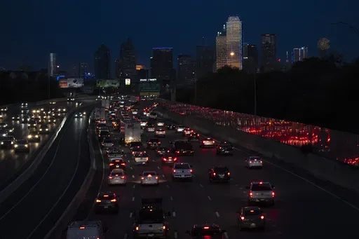 Vehicles travel along Interstate-30 with the Dallas skyline seen in the distance, Nov. 27, 2023. On Thursday, June 27, 2024, the U.S. Census Bureau released population estimates which showed Texas leading all other states in new Hispanic, Asian and Black residents added last year. (AP Photo/Julio Cortez, File)