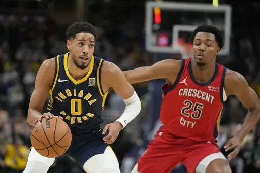 Indiana Pacers' Tyrese Haliburton (0) goes to the basket against New Orleans Pelicans' Trey Murphy III (25) during the first half of an NBA basketball game, Monday, Nov. 25, 2024, in Indianapolis. (AP Photo/Darron Cummings)