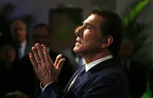 Former Las Vegas casino mogul Steve Wynn gestures at a news conference in Medford, Mass., March 15, 2016. An effort by Nevada casino regulators to impose a $500,000 fine and discipline former Las Vegas casino mogul Wynn over allegations of workplace sexual misconduct had new life Friday, April 1, 2022, after a state Supreme Court decision in a jurisdictional question. Wynn denies all allegations against him. (AP Photo/Charles Krupa, File)