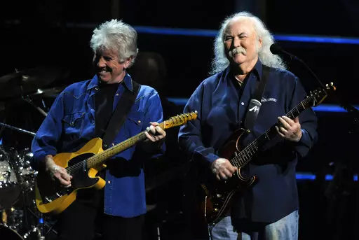 David Crosby, right, and Graham Nash perform at the 25th Anniversary Rock & Roll Hall of Fame concert at Madison Square Garden, Thursday, Oct. 29, 2009, in New York. Crosby, the brash rock musician who evolved from a baby-faced harmony singer with the Byrds to a mustachioed hippie superstar and an ongoing troubadour in Crosby, Stills, Nash & (sometimes) Young, has died at age 81. His death was reported Thursday, Jan. 19, 2023, by multiple outlets. (AP Photo/Henny Ray Abrams, File)