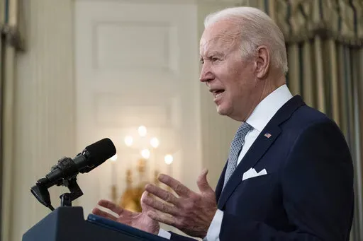 President Joe Biden speaks about the 2021 jobs report in the State Dining Room of the White House, Friday, Jan. 7, 2022, in Washington. (AP Photo/Alex Brandon)