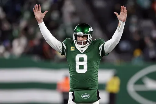 New York Jets quarterback Aaron Rodgers (8) reacts after a touchdown pass during an NFL football game against the Miami Dolphins Sunday, Jan. 5, 2025, in East Rutherford, N.J. (AP Photo/Adam Hunger, File)