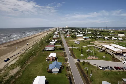 Louisiana State Highway 1 is seen from above Grand Isle, La., on July 27, 2010. Grand Isle will repeal an anti-obscenity ordinance and let a contractor fly a flag from his truck that carries an obscenity aimed at President Joe Biden, under the terms of a lawsuit settlement filed Friday, Sept. 15, 2023, in federal court. (AP Photo/Patrick Semansky, File)