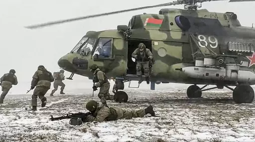 In this photo taken from video and released by the Russian Defense Ministry Press Service on Friday, Feb. 4, 2022, soldiers take part in joint drills between Belarus and Russia at Brestsky firing range in Belarus. Belarus President Alexander Lukashenko has welcomed thousands of Russian troops to his country, allowed the Kremlin to use it to launch the invasion of Ukraine on Feb. 24, 2022, and offered to station some of Moscow’s tactical nuclear weapons there. But he has avoided having Belarus 