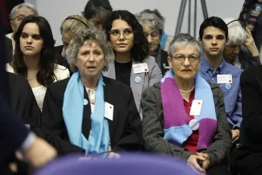 Portugal's Catarina dos Santos Mota, center, attends the session at the European Court of Human Rights Tuesday, April 9, 2024 in Strasbourg, eastern France. Europe's highest human rights court will rule Tuesday on a group of landmark climate change cases aimed at forcing countries to meet international obligations to reduce greenhouse gas emissions. The European Court of Human Rights will hand down decisions in a trio of cases brought by a French mayor, six Portuguese youngsters and more than 2,