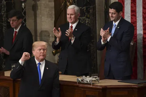 President Donald Trump gestures at the end of his State of the Union address to a joint session of Congress on Capitol Hill in Washington, Tuesday, Jan. 30, 2018. (AP Photo/Susan Walsh)