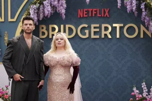Luke Newton, left, and Nicola Coughlin poses for photographers upon arrival at the season three part two screening of the television series 'Bridgerton', in London, Wednesday, June 12, 2024. (Photo by Scott A Garfitt/Invision/AP)