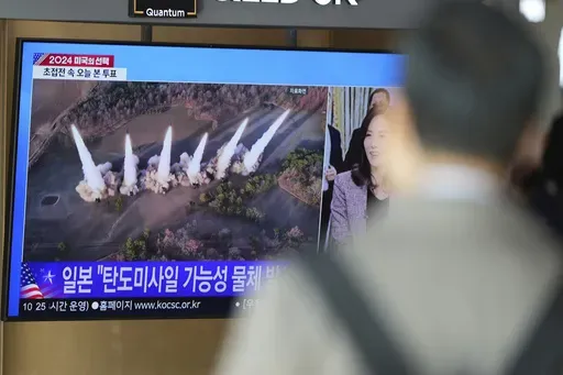 A TV screen shows a report of North Korea's multiple short-range ballistic missiles with file footage during a news program at the Seoul Railway Station in Seoul, South Korea, Tuesday, Nov. 5, 2024. (AP Photo/Lee Jin-man)