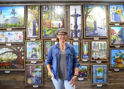 Houma artist Stacey Fabre poses for a photo in her studio on Dec. 10, 2021 in Houma, La.  Fabre grew up on the West Bank and is inspired by the New Orleans scenes she became familiar with and fantasized about in her youth. (Emily Enfinger /The Courier via AP)