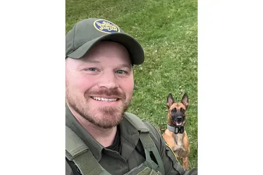 CORRECTS TO JOAN MALAND INSTEAD OF MUSSA - This undated image courtesy of Joan Maland shows U.S. Border Patrol agent David Maland and his K9 partner, Cora. David Maland was killed Monday, Jan. 20, 2025, following a traffic stop in Vermont. (David Maland/Joan Maland via AP)
