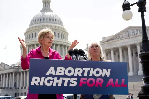 Sen. Elizabeth Warren, D-Mass., and Sen. Patty Murray, D-Wash., talk to reporters as the Supreme Court is poised to possibly overturn Roe v. Wade, at the Capitol in Washington, June 15, 2022.  The Democratic National Committee is launching a digital ad campaign to energize its voters after last month’s Supreme Court decision overturning Roe v. Wade. The ad campaign warns that Republicans’ ultimate goal is to outlaw abortion nationwide.  (AP Photo/J. Scott Applewhite, File)