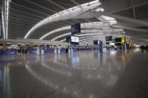 Terminal 5 at Heathrow Airport in London, which handles British Airways flights, stands virtually empty of passengers as staff standby to help during a British Airways pilots' strike, Monday, Sept. 9, 2019. British Airways cancelled dozens of flights on Friday, May 26, 2023, due to computer problems, disrupting the plans of thousands of travelers at the start of a busy holiday weekend. (AP Photo/Matt Dunham, File)