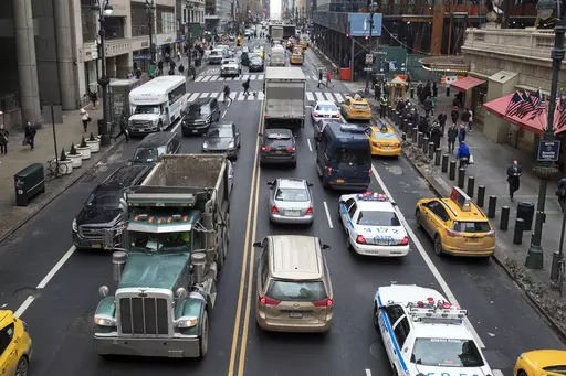 Traffic traverses 42nd Street near Grand Central Terminal, in New York, Jan. 11, 2018. Most drivers would pay $15 to enter Manhattan's central business district under a plan released by New York officials Thursday, Nov. 30, 2023. The congestion pricing plan, which neighboring New Jersey has filed a lawsuit over, will be the first such program in the United States if it receives final approval by transit officials. (AP Photo/Mary Altaffer, File)