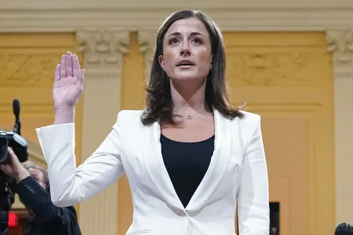 Cassidy Hutchinson, former aide to Trump White House chief of staff Mark Meadows, is sworn in to testify before the House select committee investigating the Jan. 6 attack, on Capitol Hill in Washington, June 28, 2022. Hutchinson has told the House Jan. 6 committee that her first lawyer advised her against being fully forthcoming with the panel, telling her, “the less you remember, the better.” That's according to a transcript of one of her interviews released Thursday. (AP Photo/Jacquelyn Ma