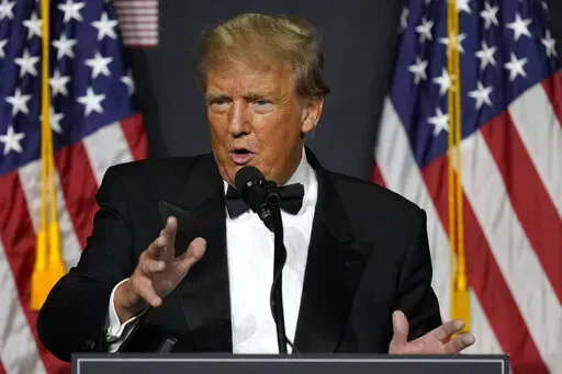 Former President Donald Trump speaks at Mar-a-Lago Friday, Nov. 18, 2022 in Palm Beach, Fla. The House panel investigating the Jan. 6 attack on the U.S. Capitol is considering recommending the Justice Department pursue three criminal charges against Trump, including insurrection. (AP Photo/Rebecca Blackwell, File)