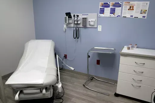 An exam room is seen inside Planned Parenthood on March 10, 2023. A lawsuit filed by 17 states challenging federal rules entitling workers to time off and other accommodations for abortions lacks standing, a federal judge in Arkansas ruled on Friday, June 14, 2024 (AP Photo/Jeff Roberson, File)