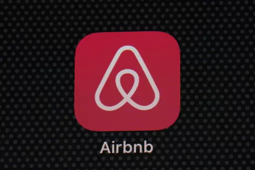 The Airbnb app icon is displayed on an iPad screen in Washington, D.C., on May 8, 2021. Airbnb says it’s banning the use of indoor security cameras in listings around the world by the end of next month. The San Francisco-based online rental platform said it making the change to simplify its security camera policy and continue efforts to prioritize privacy. (AP Photo/Patrick Semansky, File)