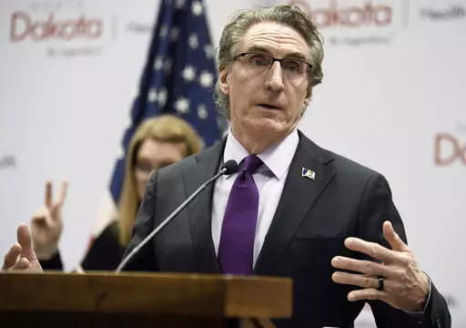 North Dakota Gov. Doug Burgum speaks at the state Capitol on April 10, 2020, in Bismarck, N.D. Burgum on Thursday, March 30, 2023, vetoed a bill that would prohibit public schools teachers and staff from referring to transgender students by pronouns other than those reflecting the sex assigned to them at birth in most cases. (Mike McCleary/The Bismarck Tribune via AP, File)