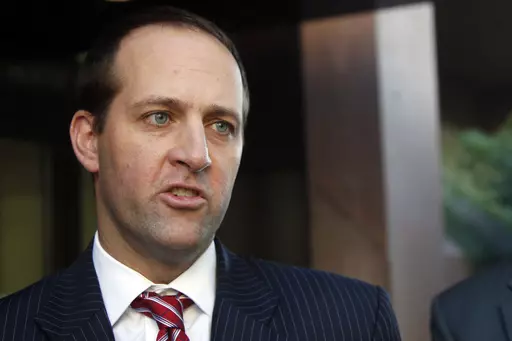 FILE- Assistant U.S. Attorney Mark Pletcher talks outside the federal courthouse, about the guilty plea of Leonard Francis, known in military circles as Fat Leonard, on bribery charges involving U.S. Navy officials Thursday, Jan. 15, 2015, in San Diego. The felony convictions of four Navy officers in a sprawling bribery case were vacated due to prosecutorial misconduct Wednesday, Sept. 6, 2023. (AP Photo/Lenny Ignelzi, File)