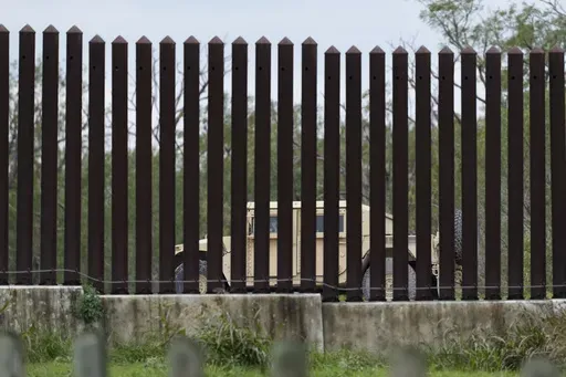 A national guardsman patrols along a stretch of boarder wall, Tuesday, Jan. 21, 2025, in Brownsville, Texas. (AP Photo/Eric Gay)