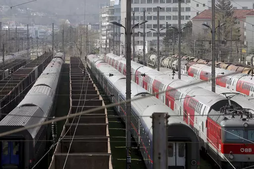 Trains are parked at a station in Vienna, Austria, Friday, March 27, 2020. Two people were charged in Austria for allegedly playing speeches by Adolf Hitler via the loudspeaker system of a train running from Bregenz to Vienna, Austrian news agency APA reported Monday, May 15, 2023. (AP Photo/Ronald Zak, File)