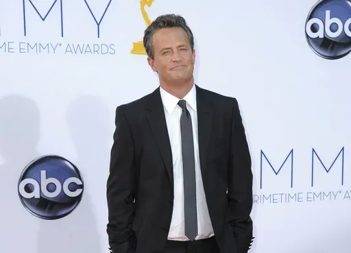 Actor Matthew Perry arrives at the 64th Primetime Emmy Awards in Los Angeles on Sept. 23, 2012. (Photo by Jordan Strauss/Invision/AP, File)