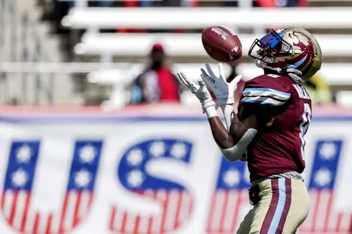 Michigan Panthers wide receiver Joe Walker (8) receives a punt during the second half of a USFL football game against the Houston Gamblers Sunday, April 17, 2022, in Birmingham, Ala. A revived United States Football League — borrowing the moniker and team nicknames from a league that went out of business 36 years ago — launched last month with all regular-season games being played in Birmingham, Alabama.  (AP Photo/Butch Dill, File)