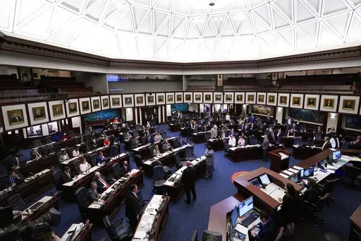 Members of the Florida House of Representatives convene during a legislative session April 30, 2021, at the Capitol in Tallahassee, Fla. On Tuesday, Feb. 22, 2022, Florida House Republicans advanced a bill, dubbed by opponents as the “Don’t Say Gay” bill, to forbid discussions of sexual orientation and gender identity in schools, rejecting criticism from Democrats who said the proposal demonizes LGBTQ people. (AP Photo/Wilfredo Lee, File)