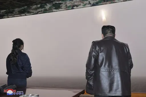 In this photo provided by the North Korean government, North Korean leader Kim Jong Un, right, and his daughter observe what it says a test launch of new intercontinental ballistic missile "Hwasong-19" at an undisclosed place in North Korea Thursday, Oct. 31, 2024. Independent journalists were not given access to cover the event depicted in this image distributed by the North Korean government. The content of this image is as provided and cannot be independently verified. Korean language waterma