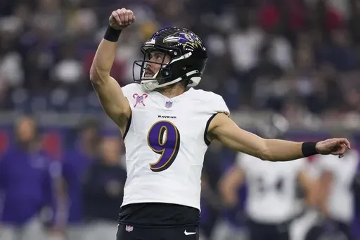 Baltimore Ravens place kicker Justin Tucker (9) watches his extra point against the Houston Texans during the first half of an NFL football game Wednesday, Dec. 25, 2024, in Houston. (AP Photo/Eric Christian Smith, File)