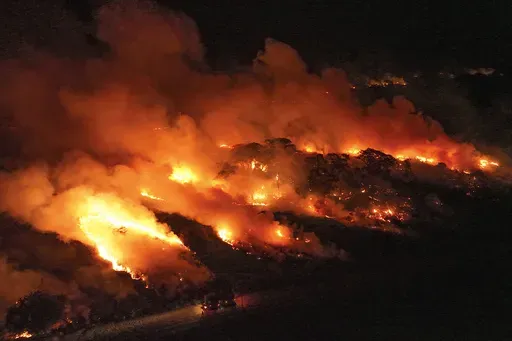 Fire consumes an area next to the Transpantaneira road in the Pantanal wetlands near Pocone, Mato Grosso state,Brazil, Nov. 15, 2023. (AP Photo/Andre Penner, File)