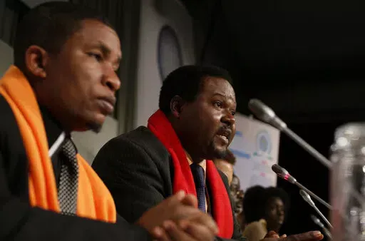 Coordinator Mithika Mwenda, left, and committee member Augustine Njamnshi, right,at a press conference of the Pan African Climate Justice Alliance at the Climate Summit, in Copenhagen Denmark, on Dec. 10, 2009. Climate activists in Africa have expressed anger toward the United Nations climate agency, accusing it of allowing corporations and individuals with “dubious” climate credentials to “greenwash” their polluting activities by participating in its annual climate conference. The criti