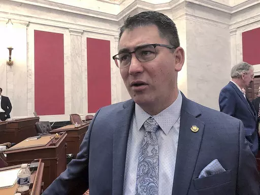 West Virginia Senate Majority Leader Tom Takubo, a Kanawha County Republican, listens to a colleague before the start of the 2020 regular legislative session Wednesday, Jan. 8, 2020, in Charleston, W.Va. The Senate passed a bill Monday, Feb. 12, 2024, that would ban smoking in cars when children age 16 and under are present. Takubo, a lung doctor, is the lead sponsor of the bill, which now goes to the House of Delegates. (AP Photo/John Raby, File)
