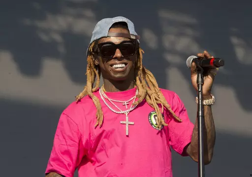 In this June 16, 2018, file photo, Lil Wayne performs on Day 3 of the 2018 Firefly Music Festival at The Woodlands in Dover, Del. Grammy Award-winning rapper Lil Wayne visited the World Series champion Houston Astros Tuesday, May 2, 2023 before their game against the San Francisco Giants. (Photo by Owen Sweeney/Invision/AP, File)
