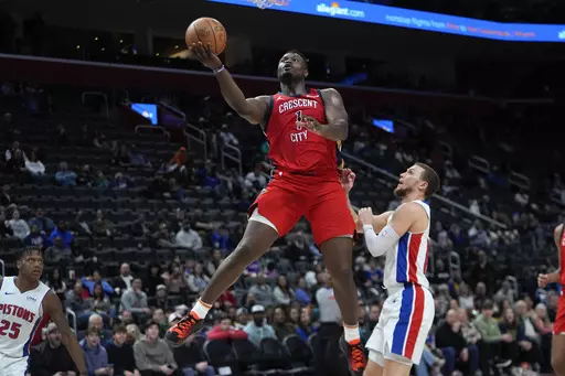 New Orleans Pelicans forward Zion Williamson (1) drives on Detroit Pistons guard Malachi Flynn (14) in the second half of an NBA basketball game in Detroit, Sunday, March 24, 2024. (AP Photo/Paul Sancya)