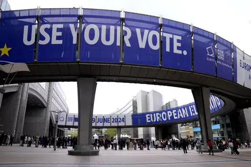 People wait in line to visit the European Parliament during Europe Day celebrations in Brussels on May 4, 2024. Voters in the European Union are set elect lawmakers for the bloc's parliament, in a major democratic exercise that's also likely to be overshadowed by online disinformation. Experts have warned about that artificial intelligence could supercharge the spread of fake news to disrupt the election in the EU and many other countries this year. (AP Photo/Virginia Mayo, File)