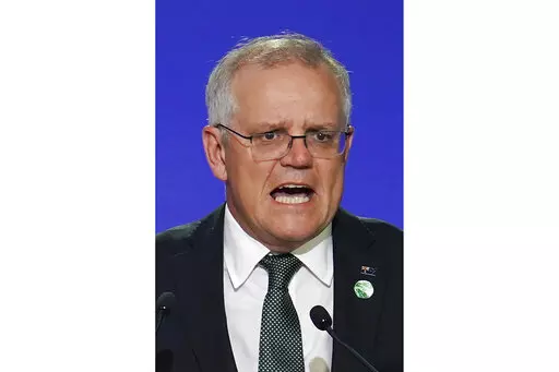 Australia's Prime Minister Scott Morrison delivers an address, during the COP26 Summit, at the SECC in Glasgow, Scotland, Monday, Nov. 1, 2021. In at least one sense, Morrison is the most successful Australian prime minister in years. He is the first to survive in office from one election to the next since 2007. That year, the government of Australia's second-longest-serving Prime Minister John Howard was voted out after a reign of almost 12 years. (Ian Forsyth/Pool Photo via AP, File)