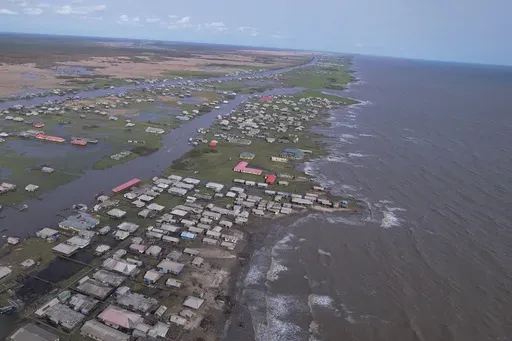 In this screen grab taken from a drone video, a view of the coastal erosion in Ayetoro, Southwest Nigeria, Friday, April 5, 2024. Ayetoro, a coastal community more than 200 km southeast of Nigeria's business capital Lagos, has been experiencing coastal erosion for many years. But the changes have recently rapidly worsened with the community slumping into the Atlantic Ocean, leading to repeated displacements of households and businesses. (AP Photo/Dan Ikpoyi)
