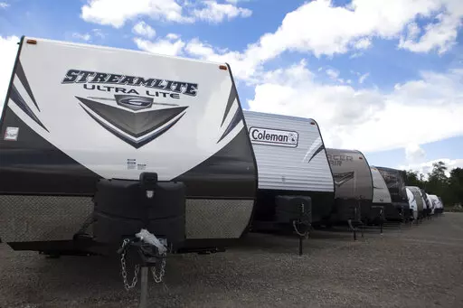 Recreational vehicles sit in a lot waiting for delivery at Horizon Transport in Wakarusa, Ind. on July 15, 2014. RV delivery is a growing trend that allows travelers to enjoy all of the conveniences of staying in an RV without actually having to drive it. Several companies offer delivery services for customers who rent, which can not only be more convenient, but also more affordable. (James Buck/The Elkhart Truth via AP)