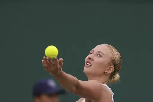 Russia's Anastasia Potapova serves to Russia's Mirra Andreeva during the women's singles match on day seven of the Wimbledon tennis championships in London, Sunday, July 9, 2023. (AP Photo/Alberto Pezzali)