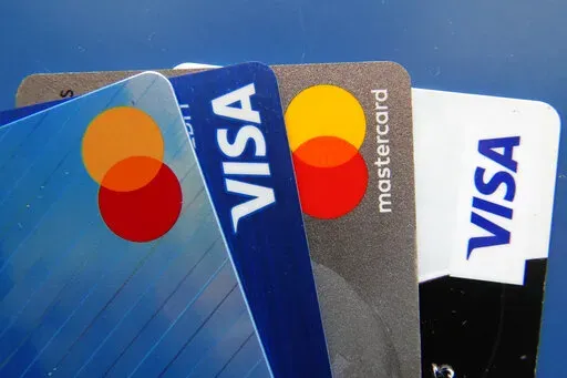 Credit cards as seen Thursday, July 1, 2021, in Orlando, Fla.  Record low-interest mortgages are long gone. Credit card rates will likely rise. You'll pay more for an auto loan. The unusually large three-quarter point hike, Wednesday, June 15, 2022 in the Fed's benchmark short-term rate is going to have a lot of impacts on Americans' finances. The hope is that by making borrowing more expensive, the Fed will succeed in cooling demand for homes, cars and other goods and services and slow inflatio