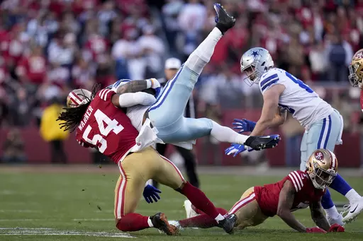 San Francisco 49ers linebacker Fred Warner (54) tackles Dallas Cowboys running back Ezekiel Elliott during the first half of an NFL divisional round playoff football game in Santa Clara, Calif., Sunday, Jan. 22, 2023. Warner has been the lynchpin of the Niners defense since arriving in 2018. (AP Photo/Godofredo A. Vásquez, File)