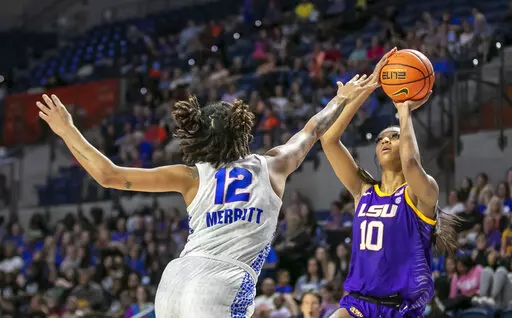 Florida forward Jordyn Merritt (12) defends against LSU forward Angel Reese (10) during the second half of an NCAA college basketball game Sunday, Feb. 19, 2023, in Gainesville, Fla. (AP Photo/Alan Youngblood)