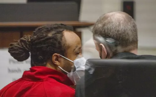 Darrell Brooks Jr. appears in Waukesha County court on Friday, Jan. 14, 2022 in Waukesha, Wis. Brooks, accused of killing six people and injuring dozens more when he drove an SUV through a suburban Christmas parade must stand trial, a court commissioner ordered Friday. (Derek Johnson/Waukesha Freeman via AP, Pool)